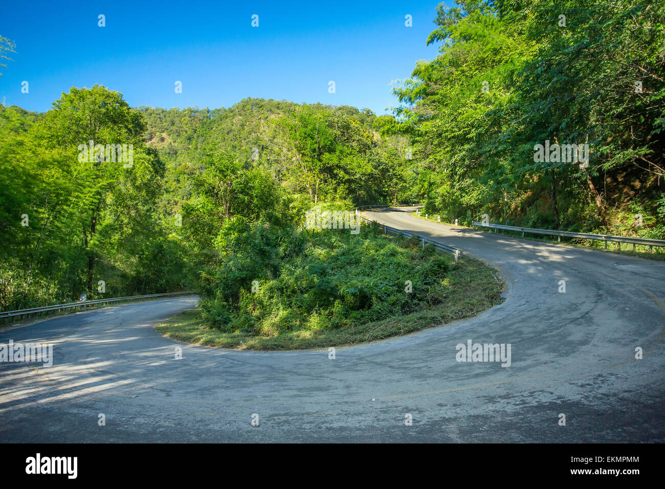180 degree curve of the mountain road Stock Photo