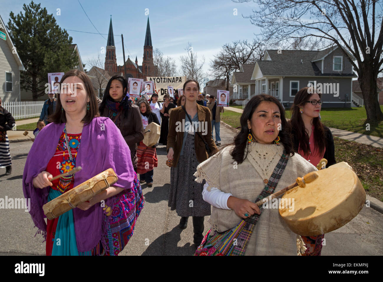 Detroit, Michigan, USA. 12th April, 2015. Demonstrators marched through Detroit's Mexican-American neighborhood to protest the September 2014 disappearance of 43 teachers college students in the southern Mexican state of Guerrero. The students from Ayotzinapa Teacher Training College were apparently arrested by local police who handed them over to a drug gang. Relatives of the disappeared joined the protest; they are traveling to cities across the U.S. to tell their story. Credit:  Jim West/Alamy Live News Stock Photo