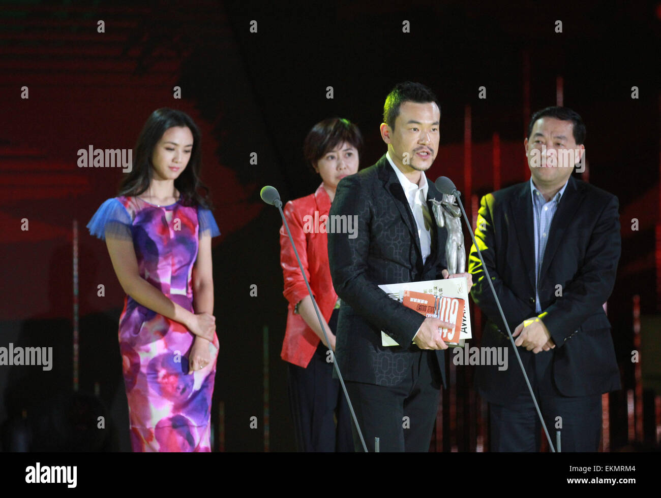 Beijing, China. 12th Apr, 2015. Liao Fan (2nd R), winner of the Actor of the Year award for his movie 'Black Coal, Thin Ice', speaks at the 2014 annual awarding conference of China Film Directors' Guild in Beijing, capital of China, April 12, 2015. © Jin Liangkuai/Xinhua/Alamy Live News Stock Photo