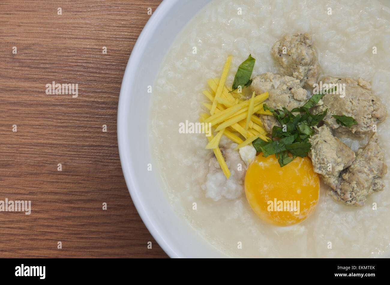 Rice porridge with pork meatballs and egg Stock Photo