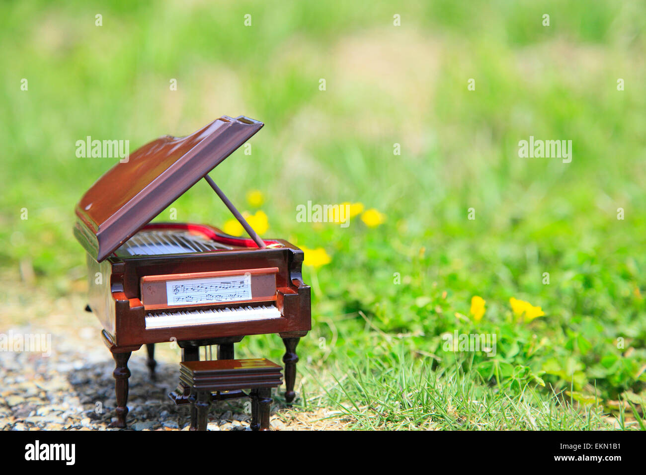 Miniature piano in nature Stock Photo