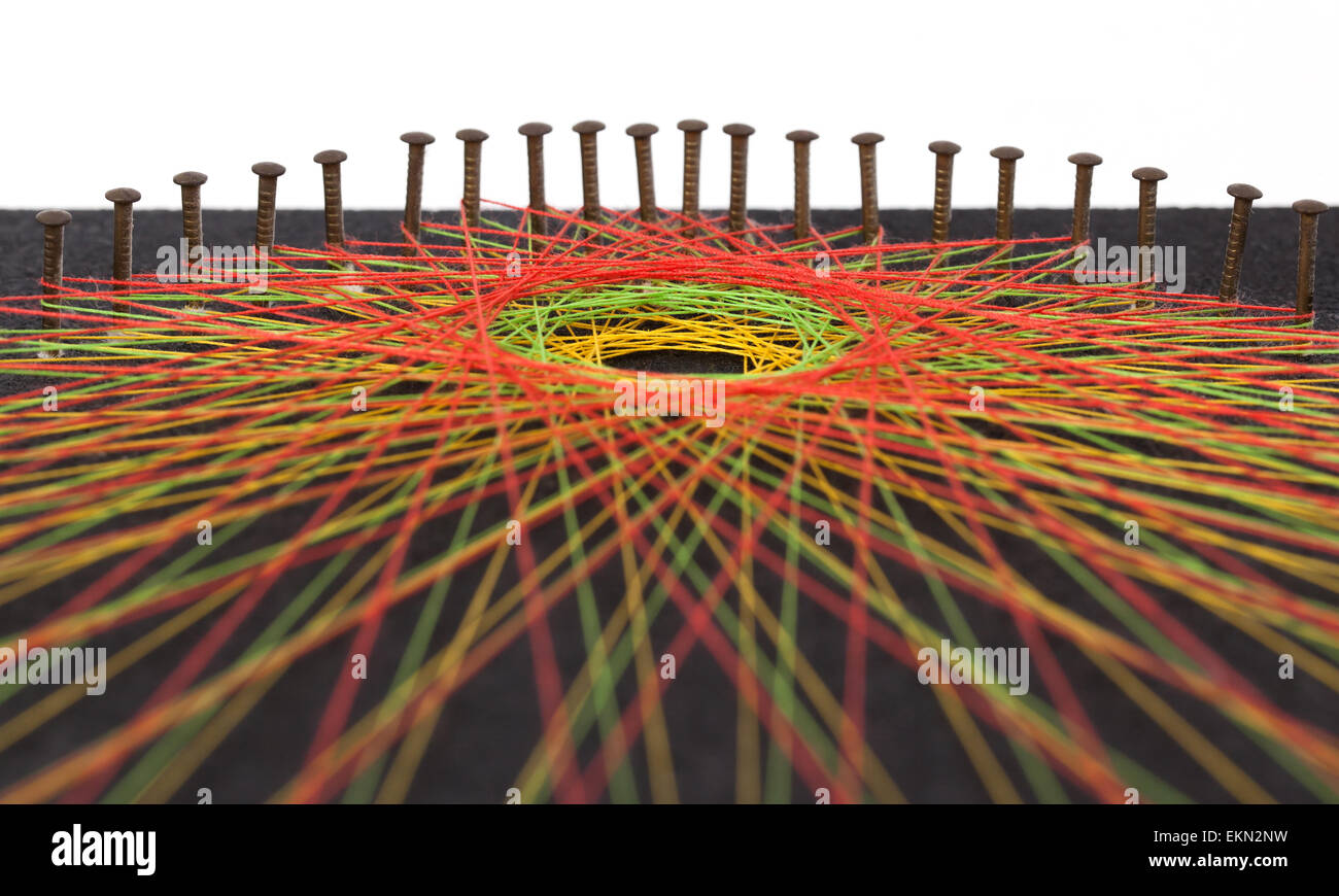 Display of colorful threads on a black panel Stock Photo - Alamy