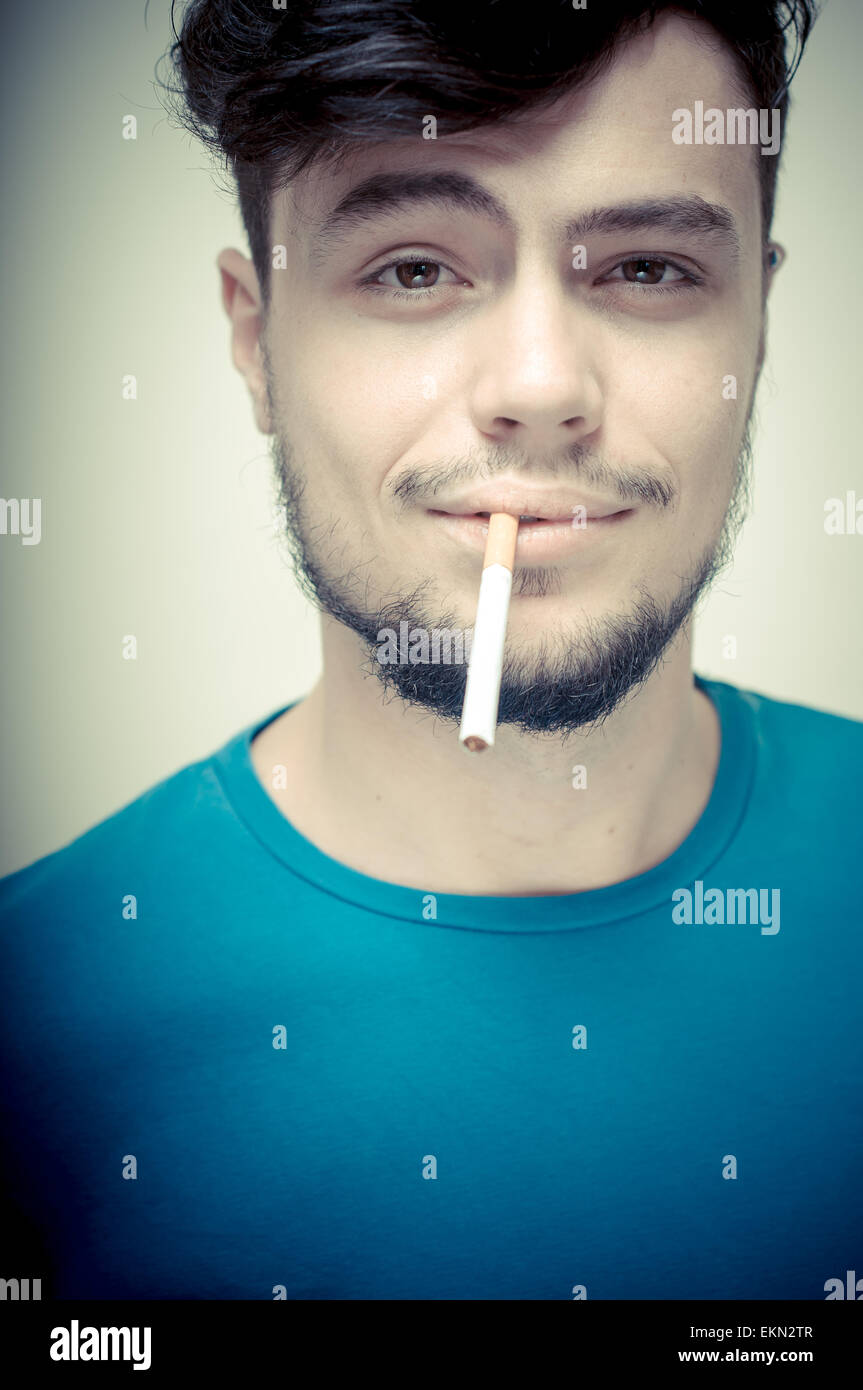 stylish young modern man with cigarette Stock Photo