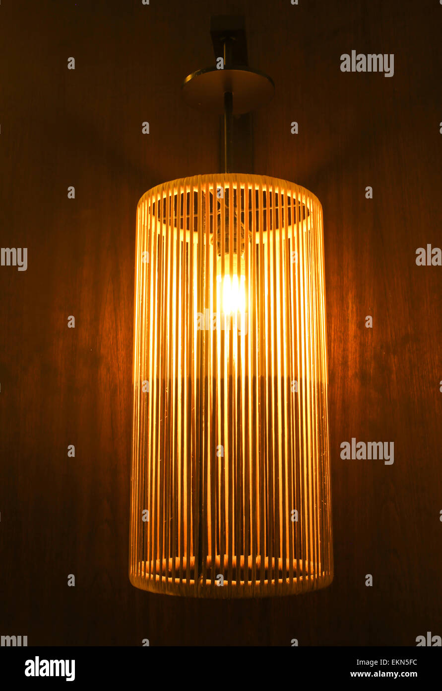 Handicraft electric lamp on wall Stock Photo