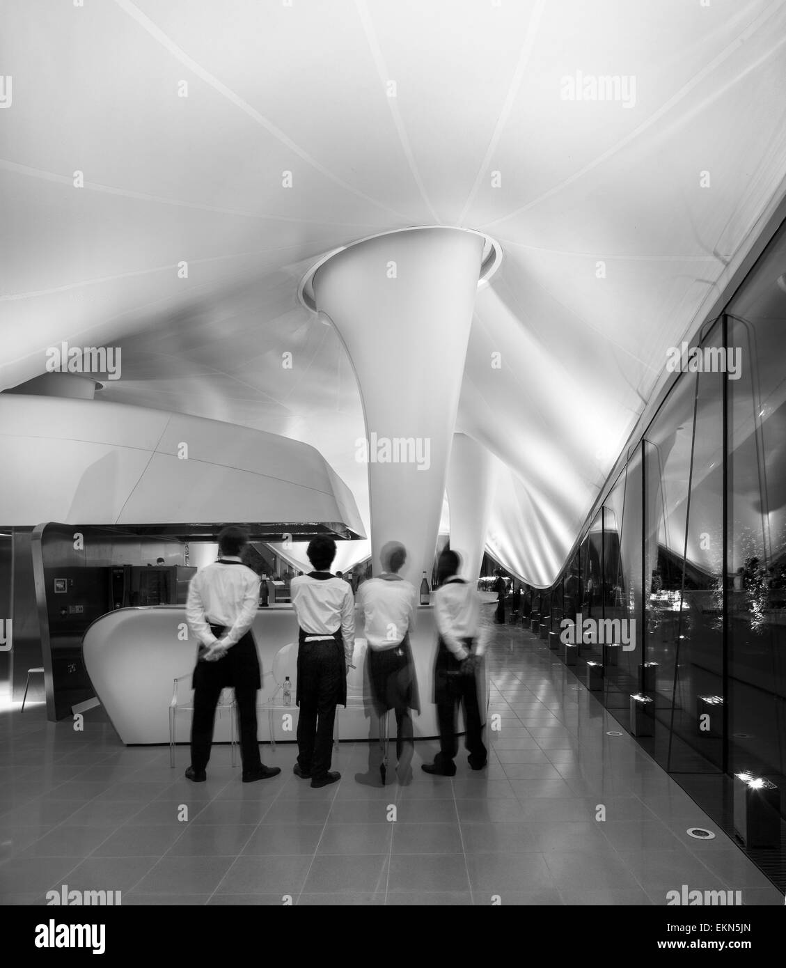 Sackler Gallery, Magazine restaurant interior, with waiters. Serpentine Sackler Gallery, London, United Kingdom. Architect: Zaha Stock Photo