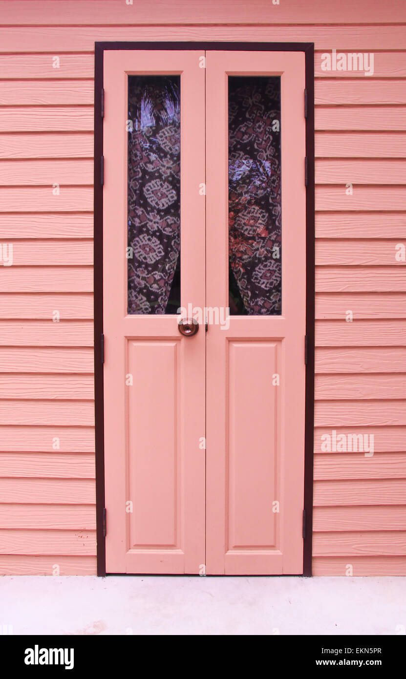 Pink front door to the house Stock Photo