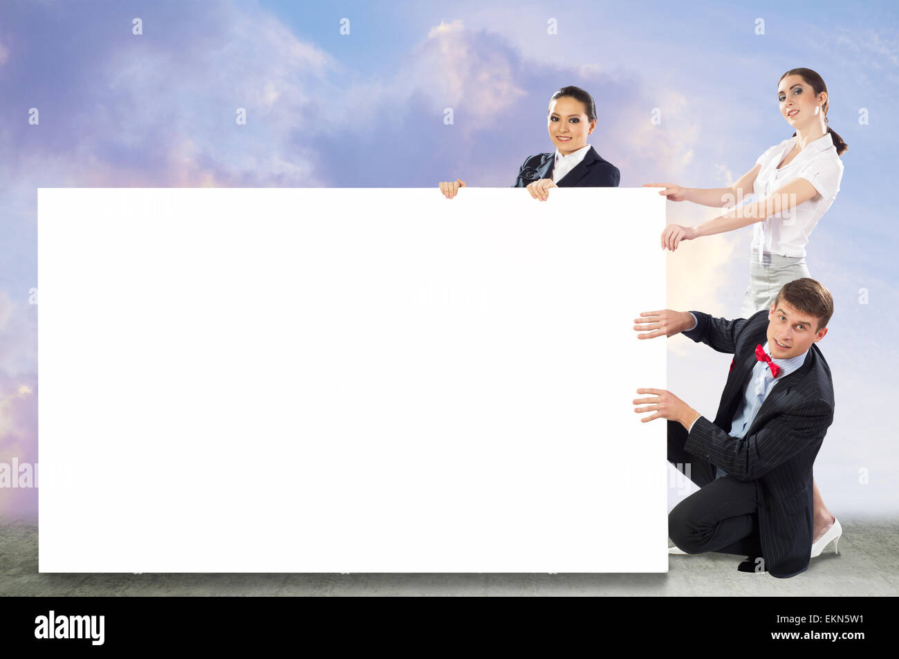 small group of people holding a blank banner Stock Photo - Alamy