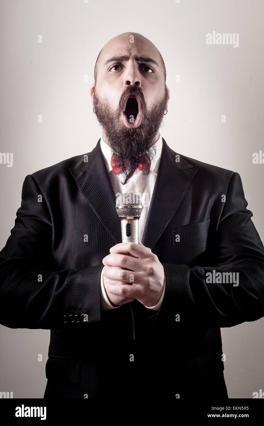 Silly Looking Singer Funny elegant singer bearded Stock Photo - Alamy