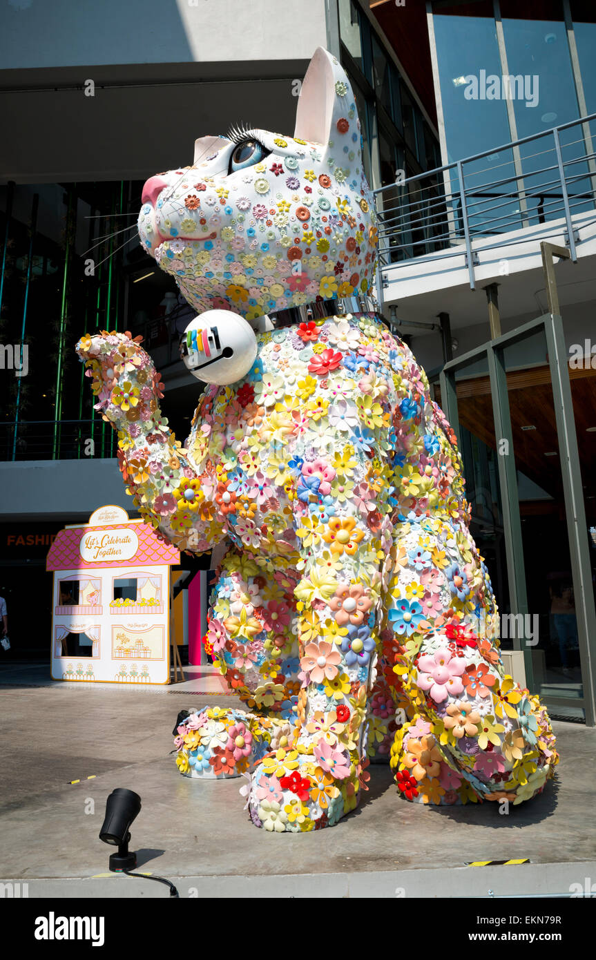 Large, colourful beckoning cat statue, similar to a maneki-neko, Siam Square, Bangkok, Thailand; big quirky Thai beckoning cat; good luck symbol; Stock Photo