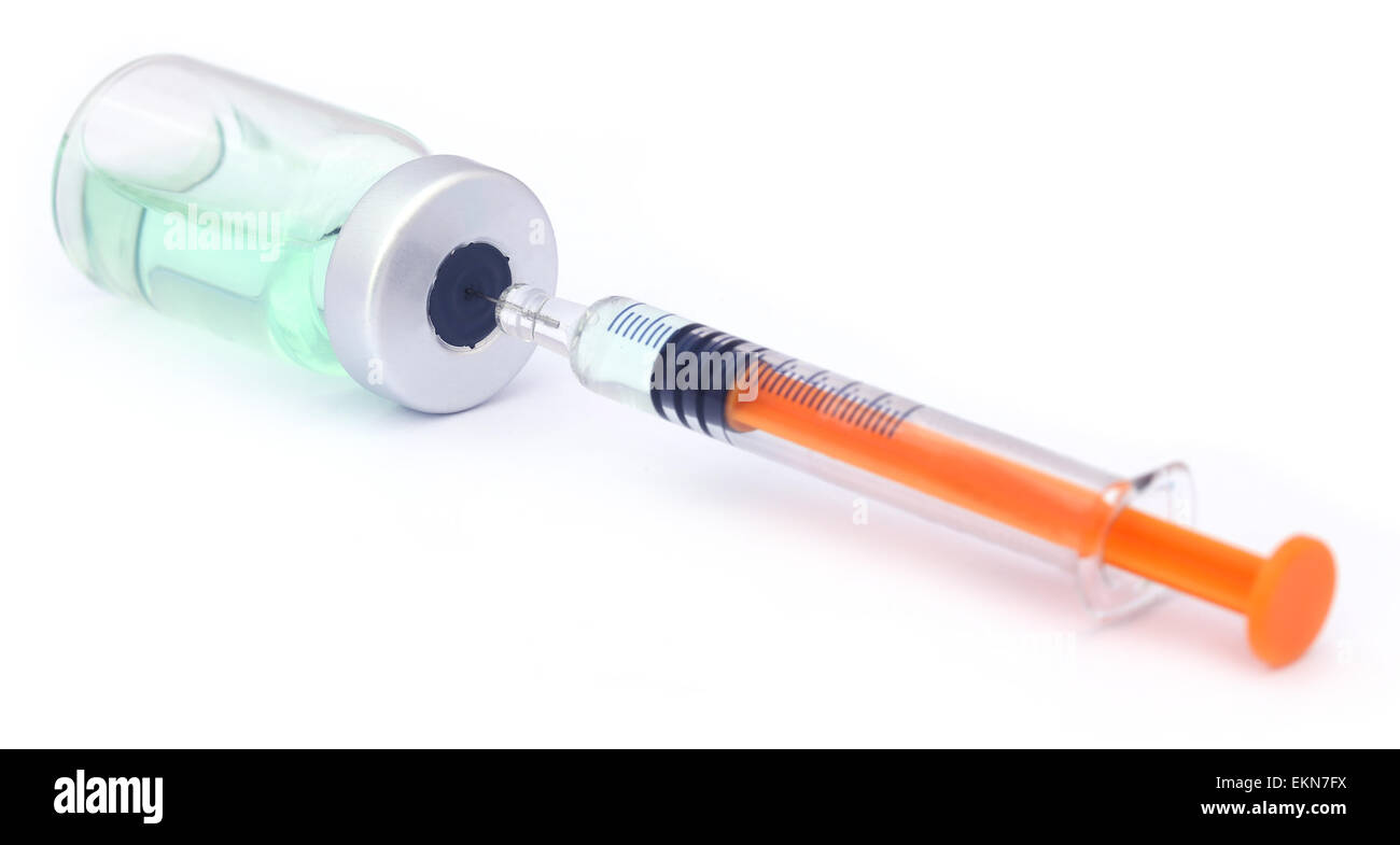 Vial with syringe over white background Stock Photo