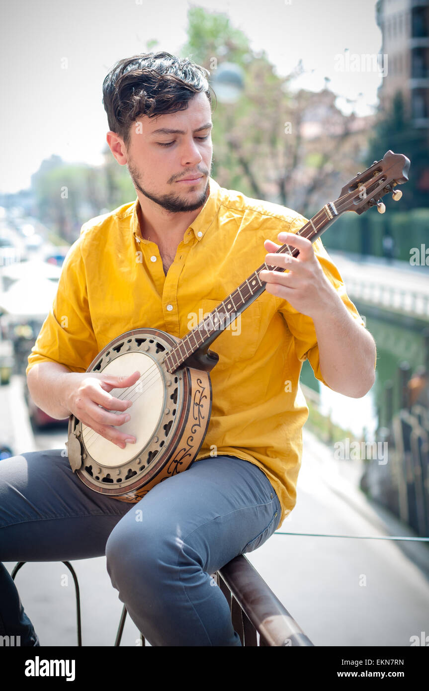 hipster young man playing banjo Stock Photo