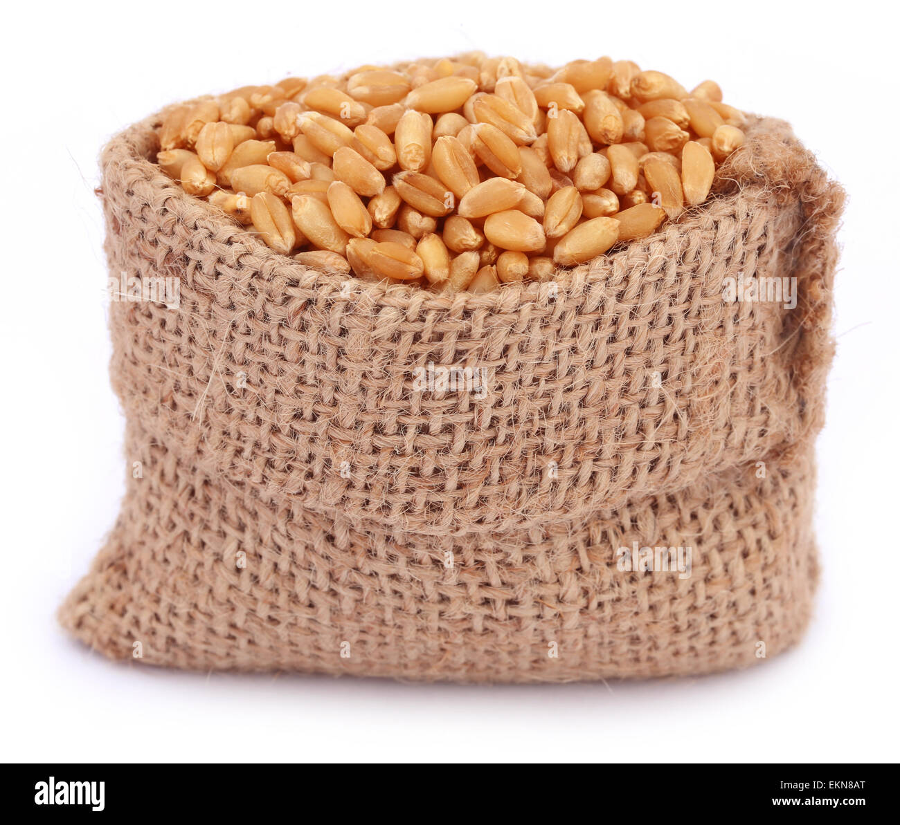 Wheat in a sack bag over white background Stock Photo