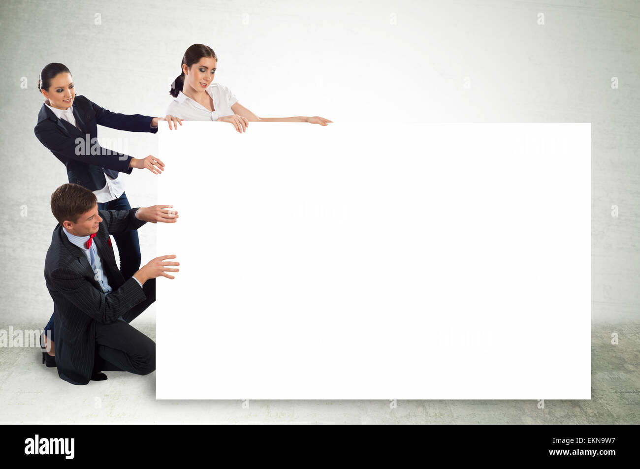 small group of people holding a blank banner Stock Photo - Alamy