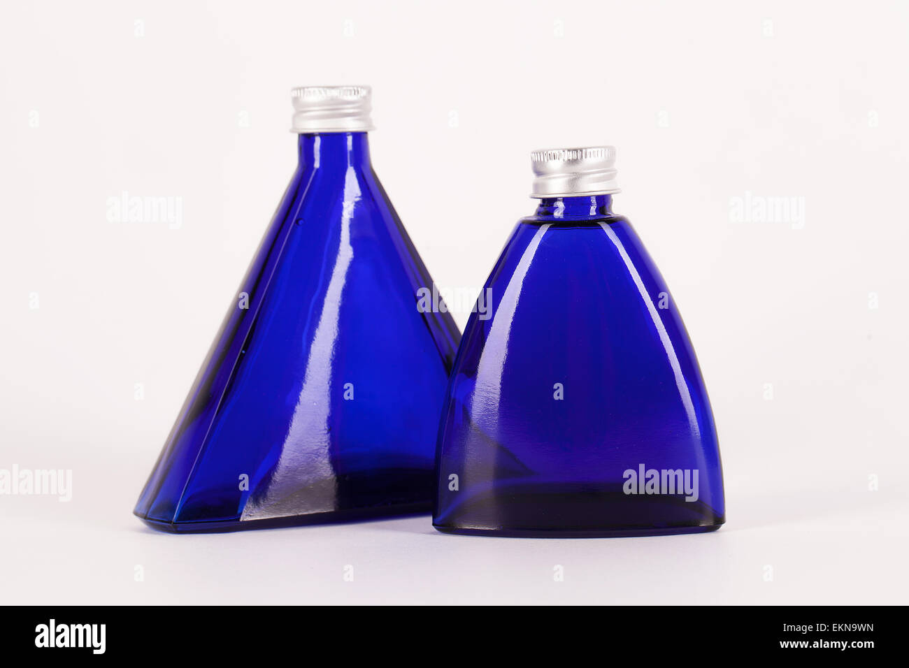 Little blue bottles isolated over white background Stock Photo Alamy