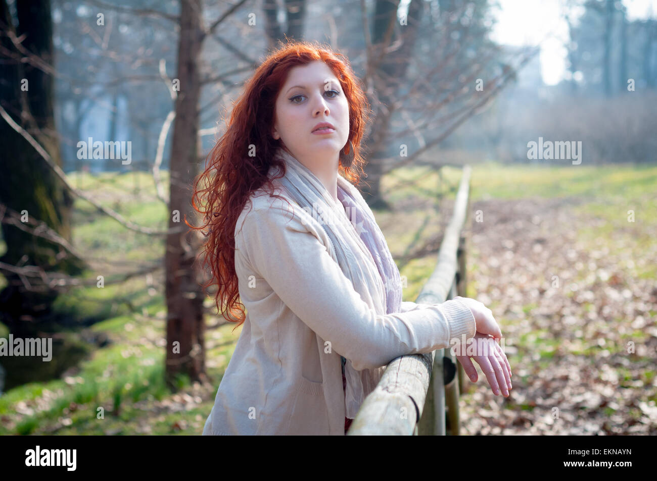 beautiful young woman posing in the park Stock Photo - Alamy