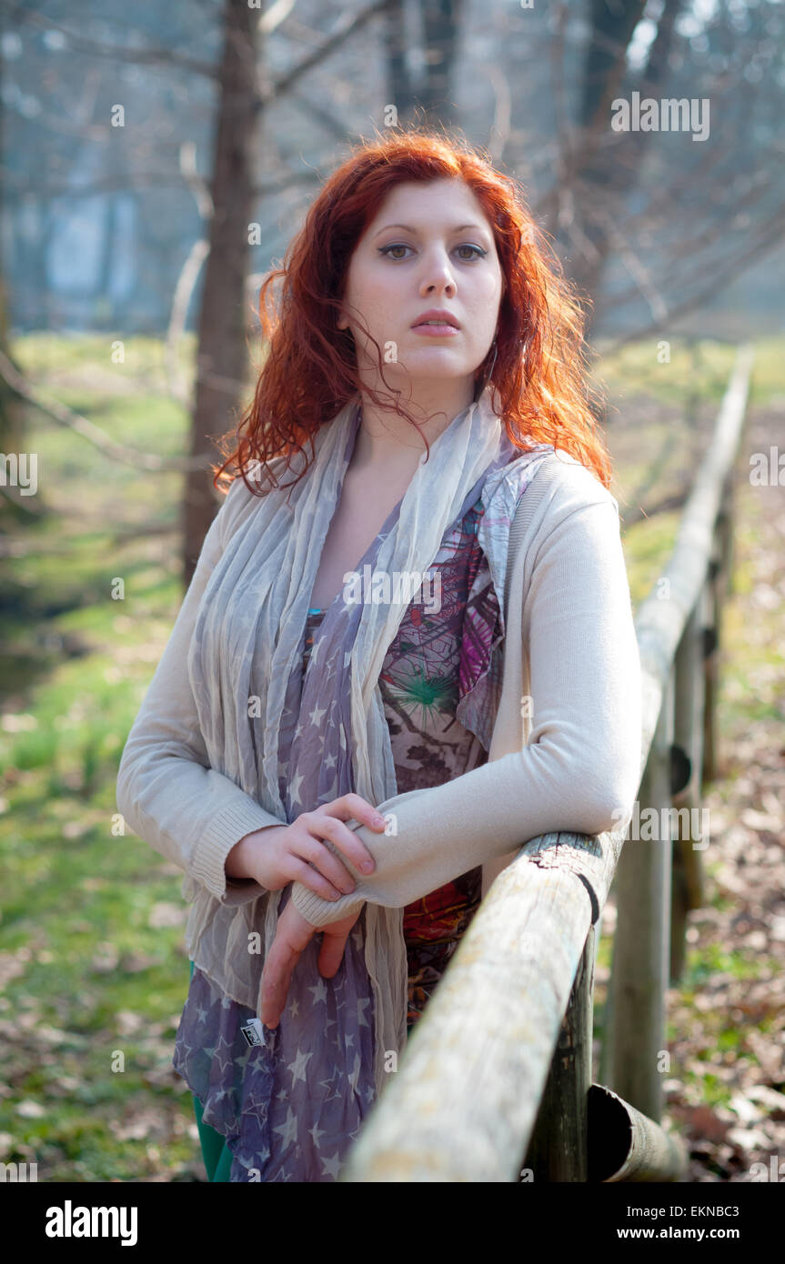 beautiful young woman posing in the park Stock Photo - Alamy