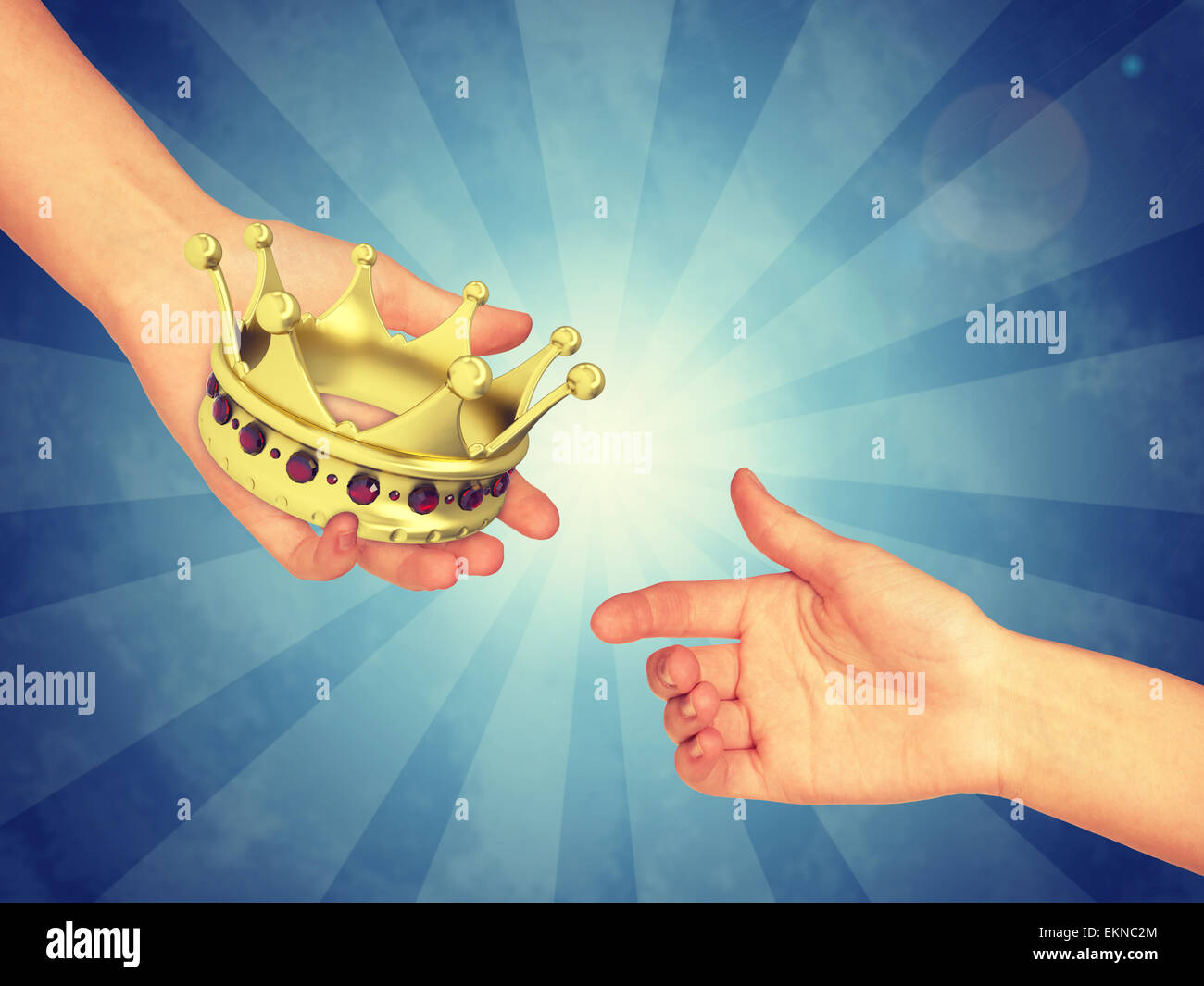 Hand passing gold crown Stock Photo