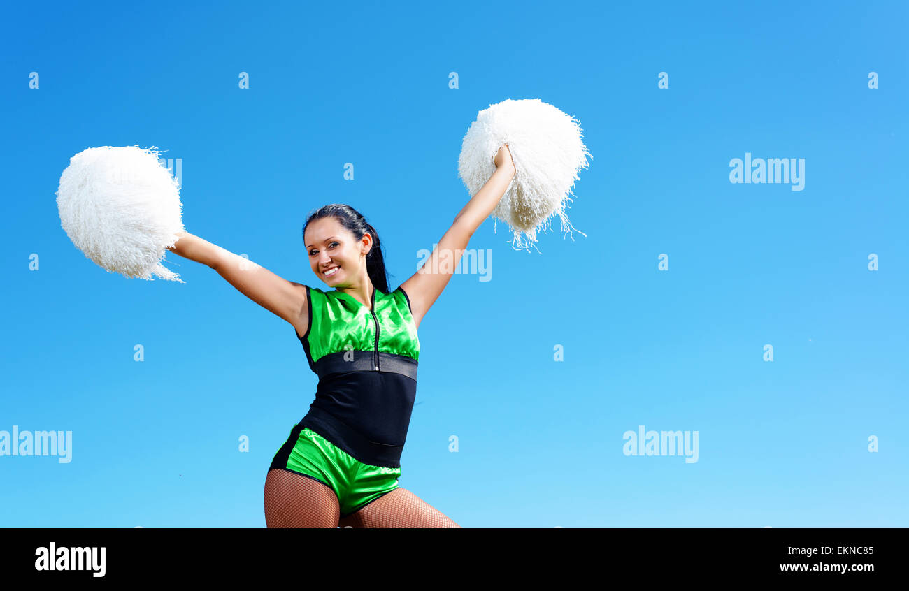 Portrait of cheerleader ( 8-9 years) holding pom-pom Stock Photo - Alamy