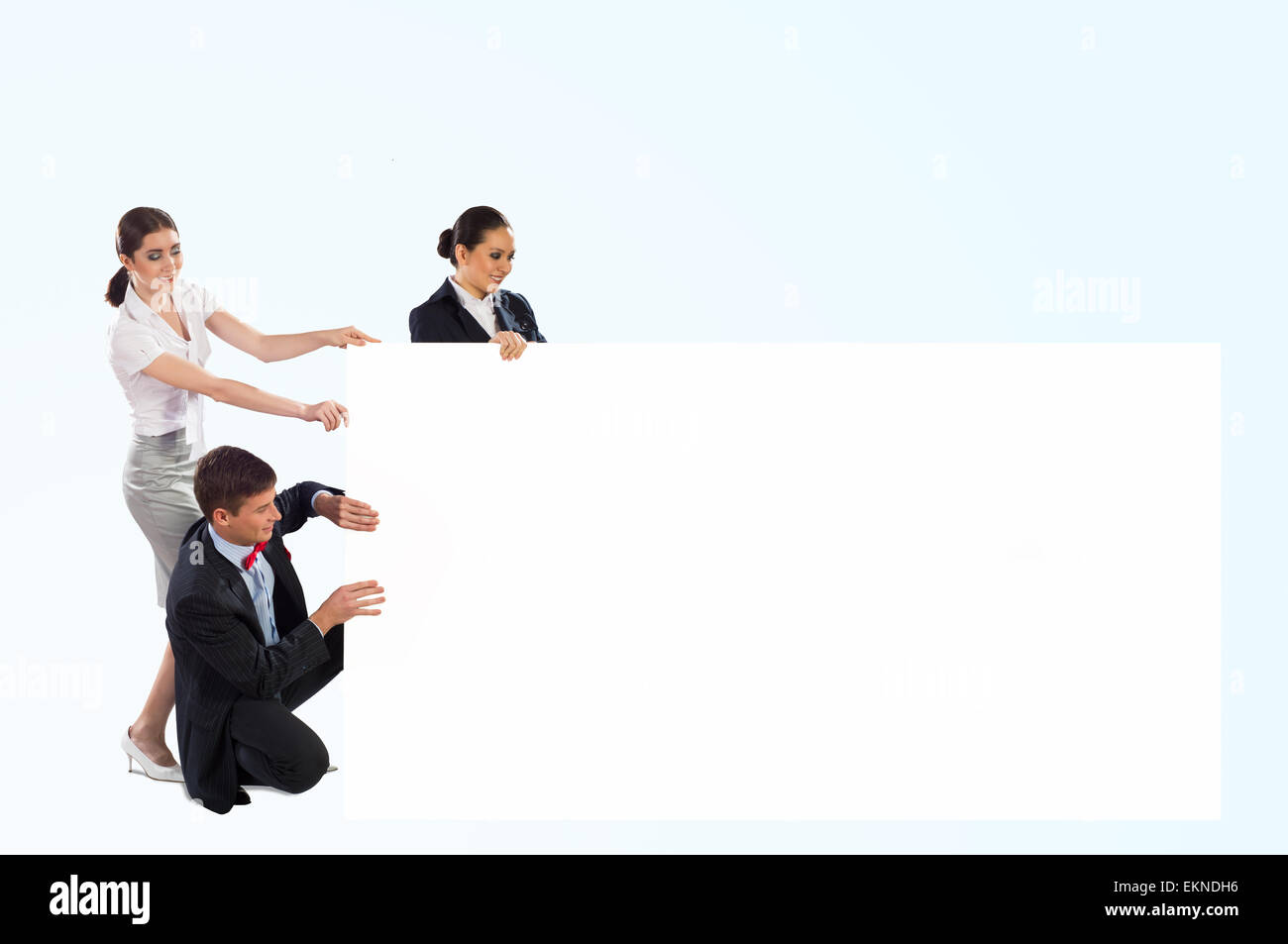 small group of people holding a blank banner Stock Photo - Alamy