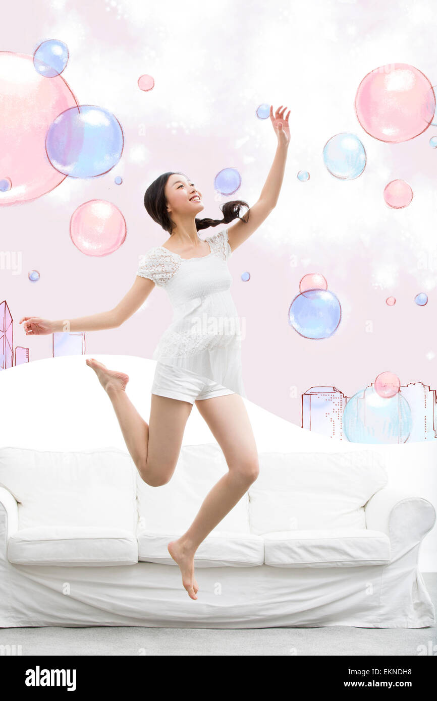 Indian young woman jumping hi-res stock photography and images - Alamy