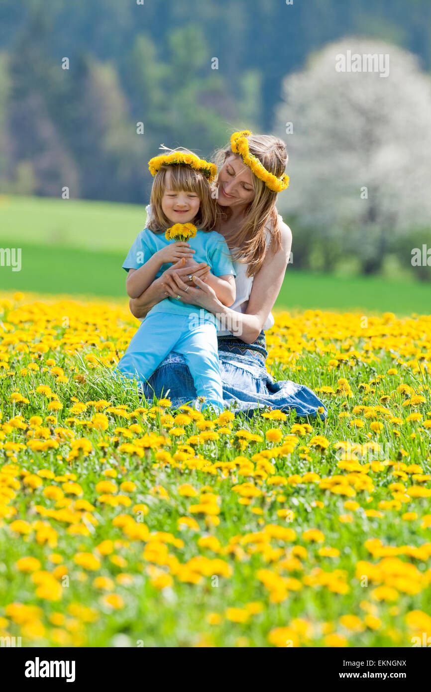 mother and son in dandelion field Stock Photo - Alamy