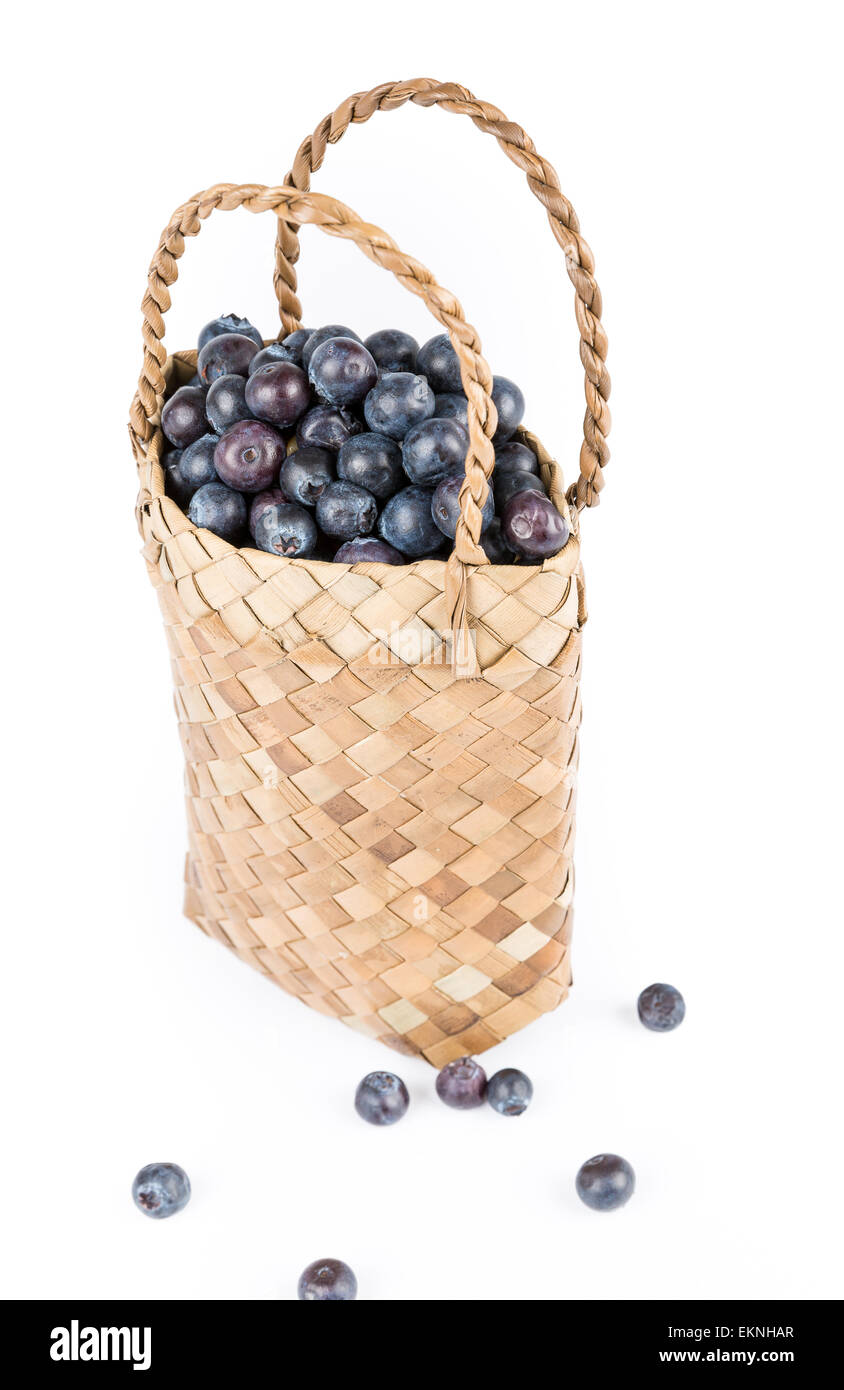 Wicker basket with Blueberries Isolate on white Stock Photo