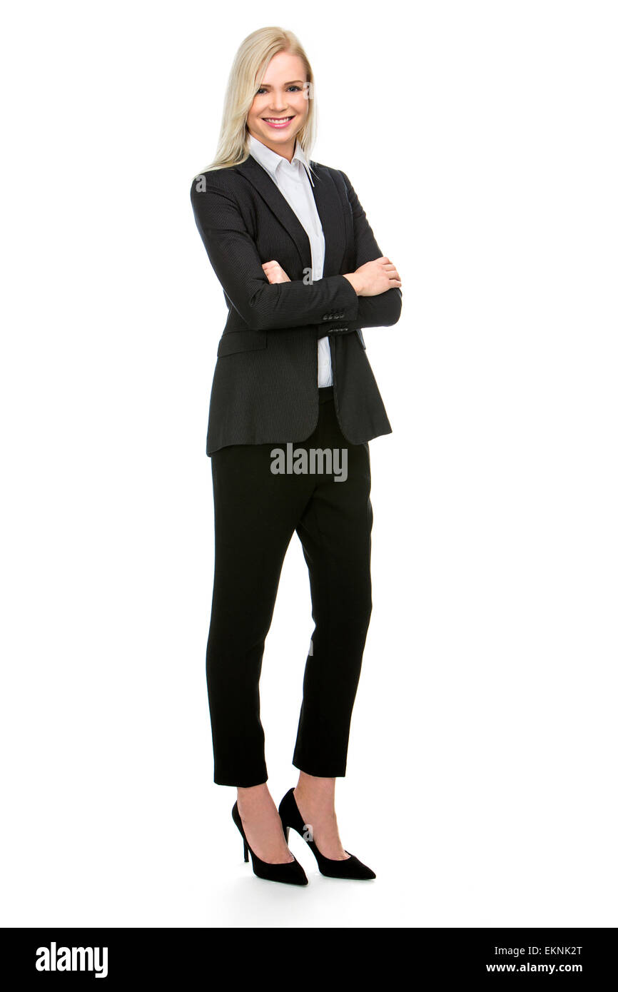 blonde businesswoman with her arms folded smiling at the camera Stock Photo