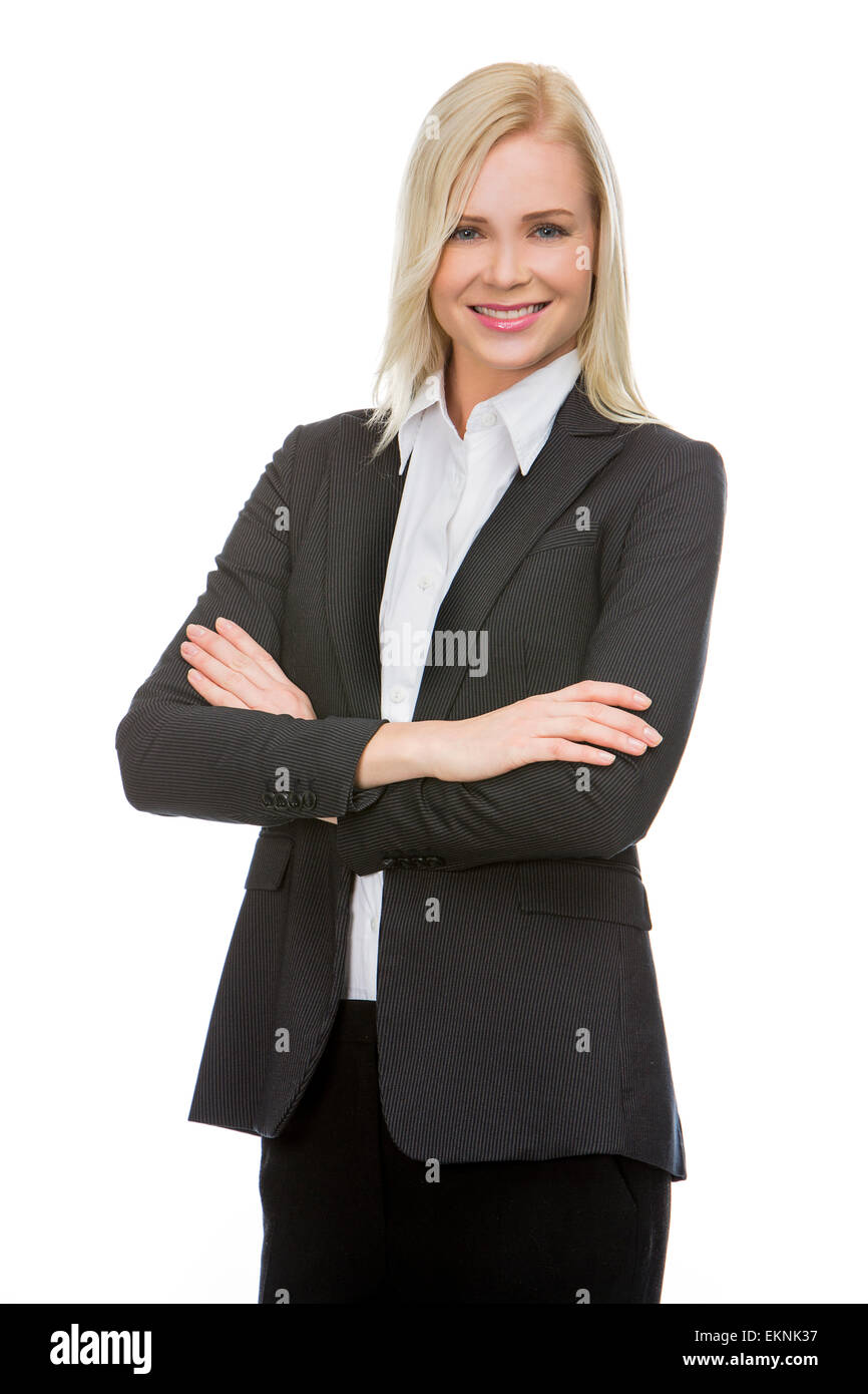 blonde businesswoman with her arms folded smiling at the camera Stock Photo