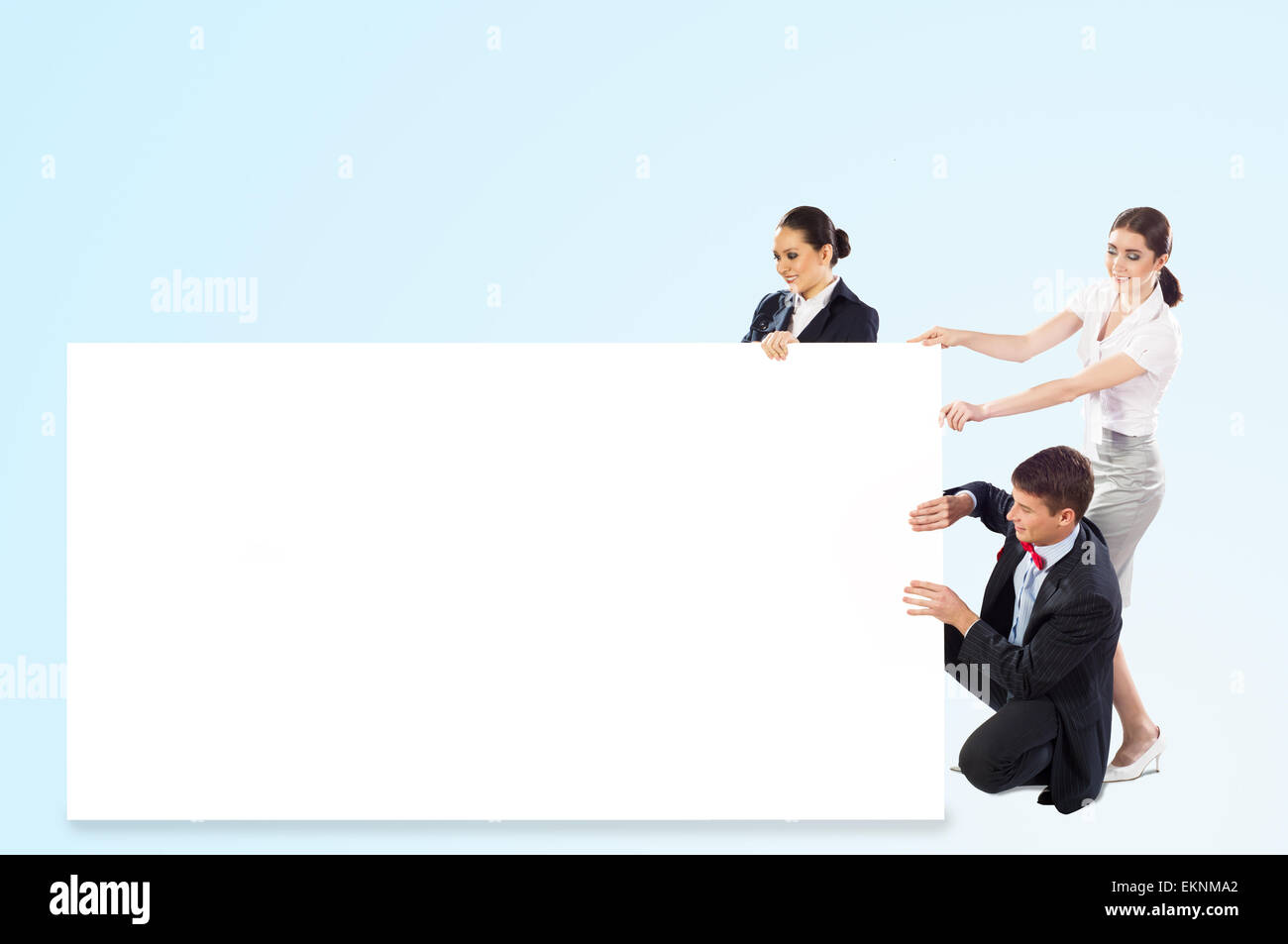 small group of people holding a blank banner Stock Photo - Alamy