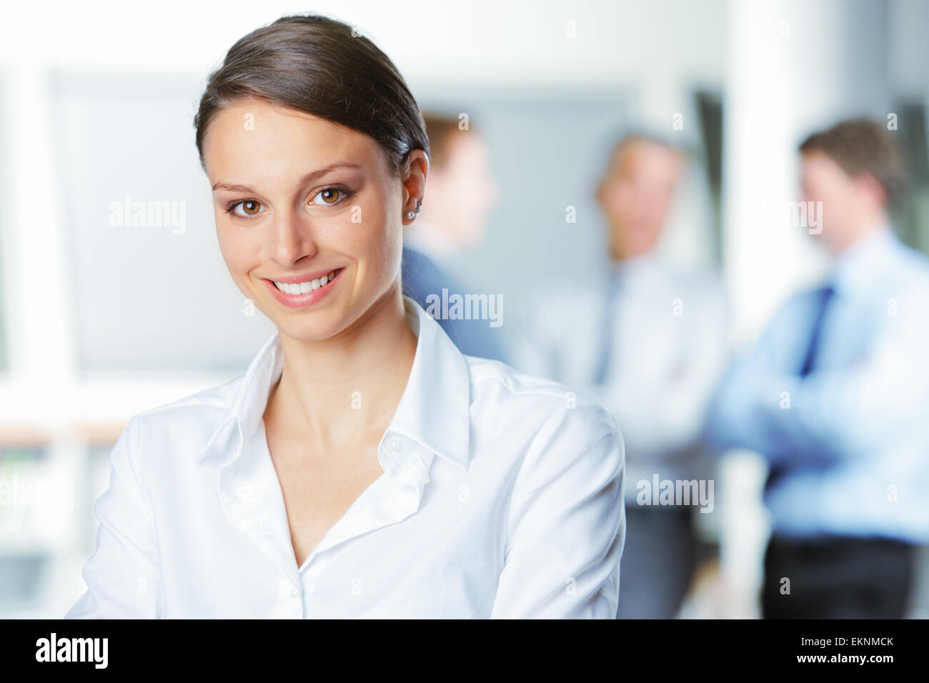 Smiling young business woman Stock Photo - Alamy