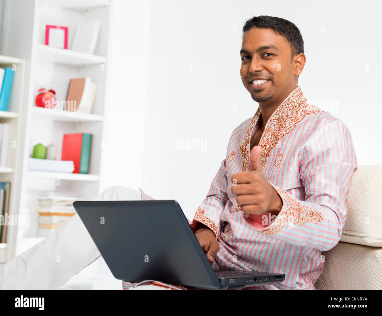 Indian man using computer at home Stock Photo - Alamy