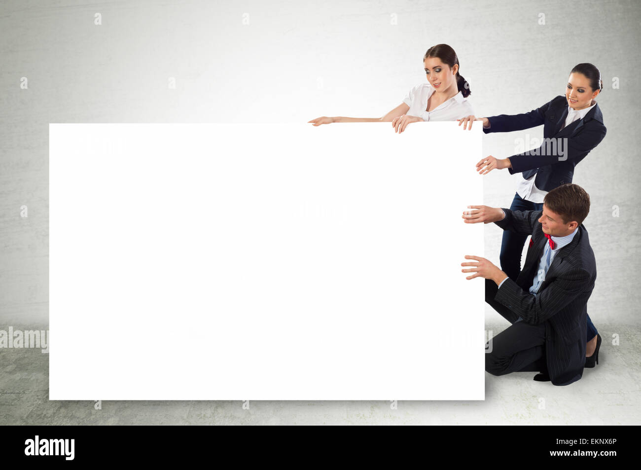 small group of people holding a blank banner Stock Photo - Alamy