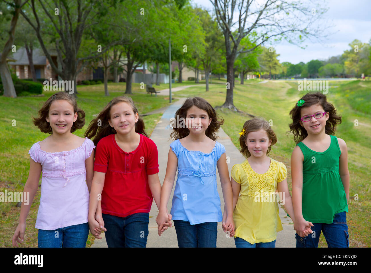 Children group of sisters girls and friends walking in park Stock Photo ...