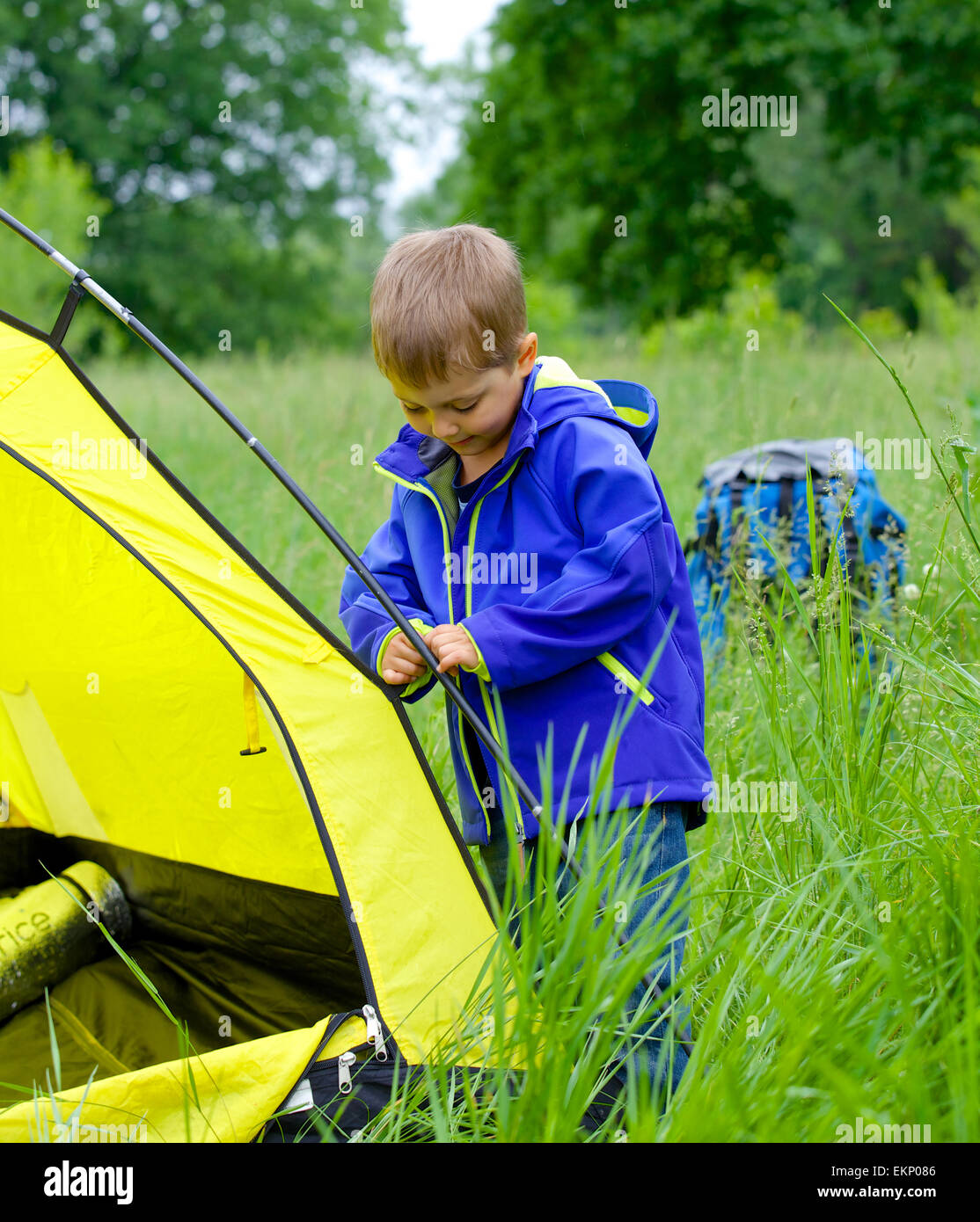 young boy camping with tent Stock Photo Alamy