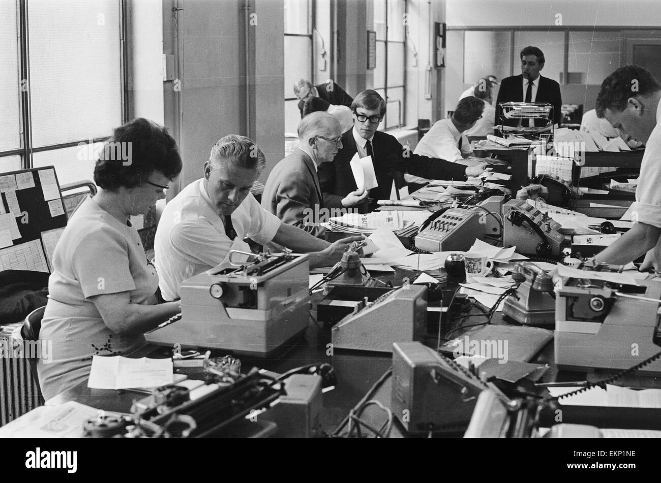 Busy scenes on the Daily Herald news desk, 1964 Stock Photo Alamy