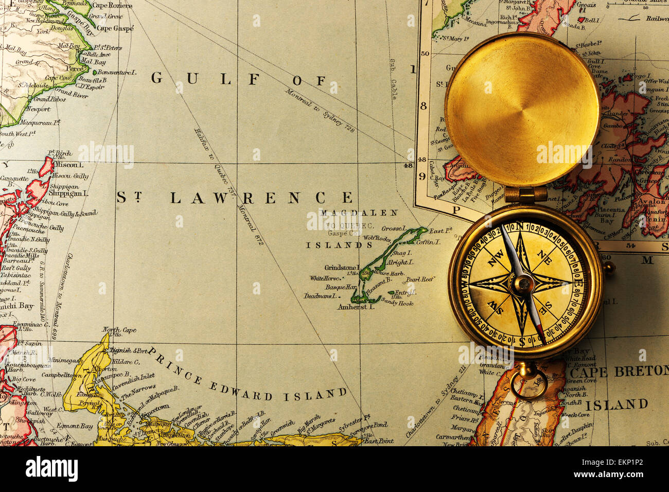 Antique compass over old XIX century map Stock Photo