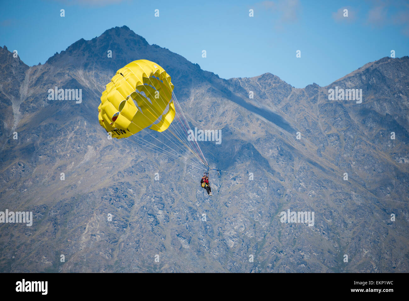 Paragliding over Lake Wakatipu, Queenstown, north island, New Zealand. Stock Photo