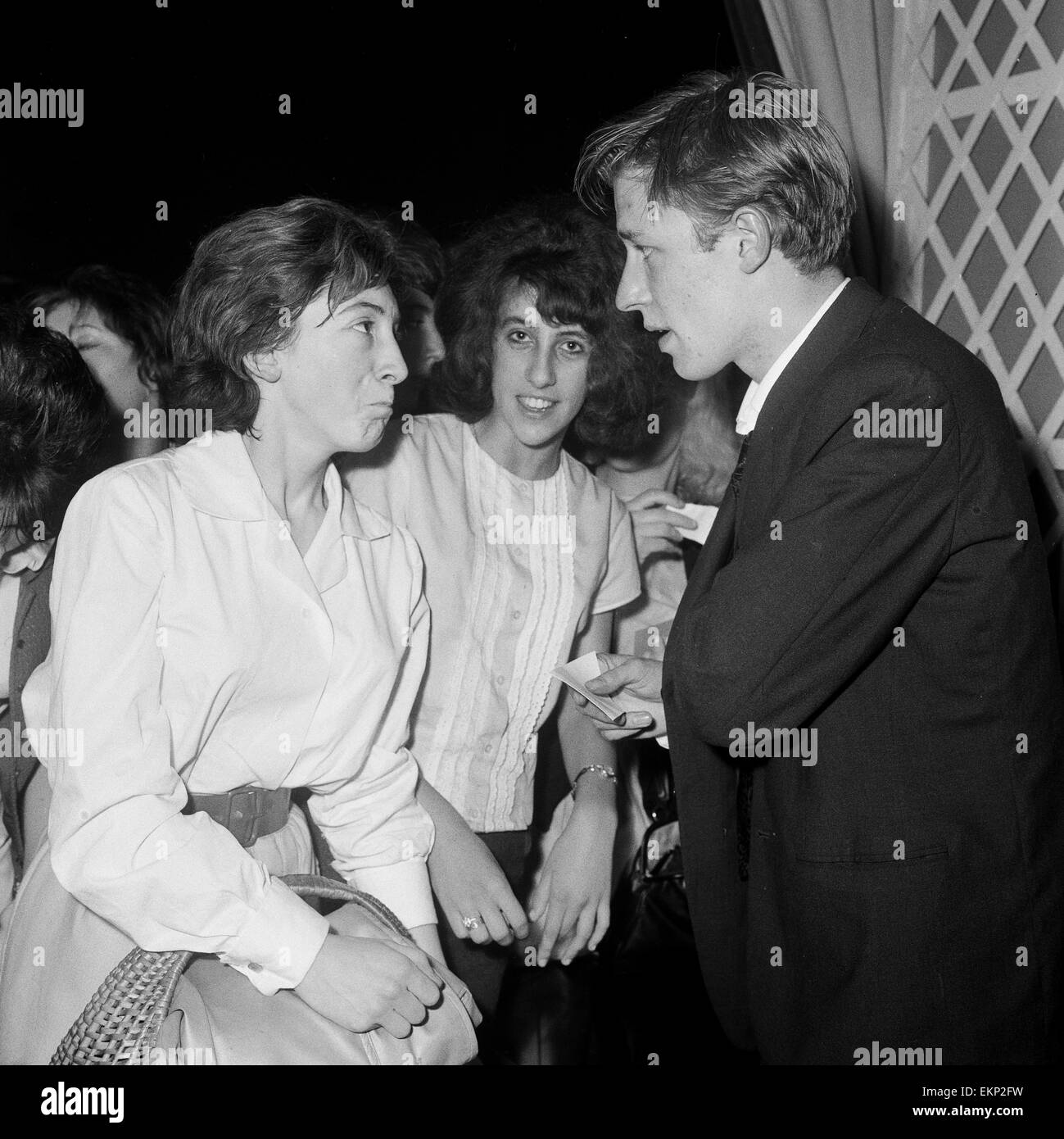 British pop singer Mike Sarne with female fans. 12th September 1962. Stock Photo