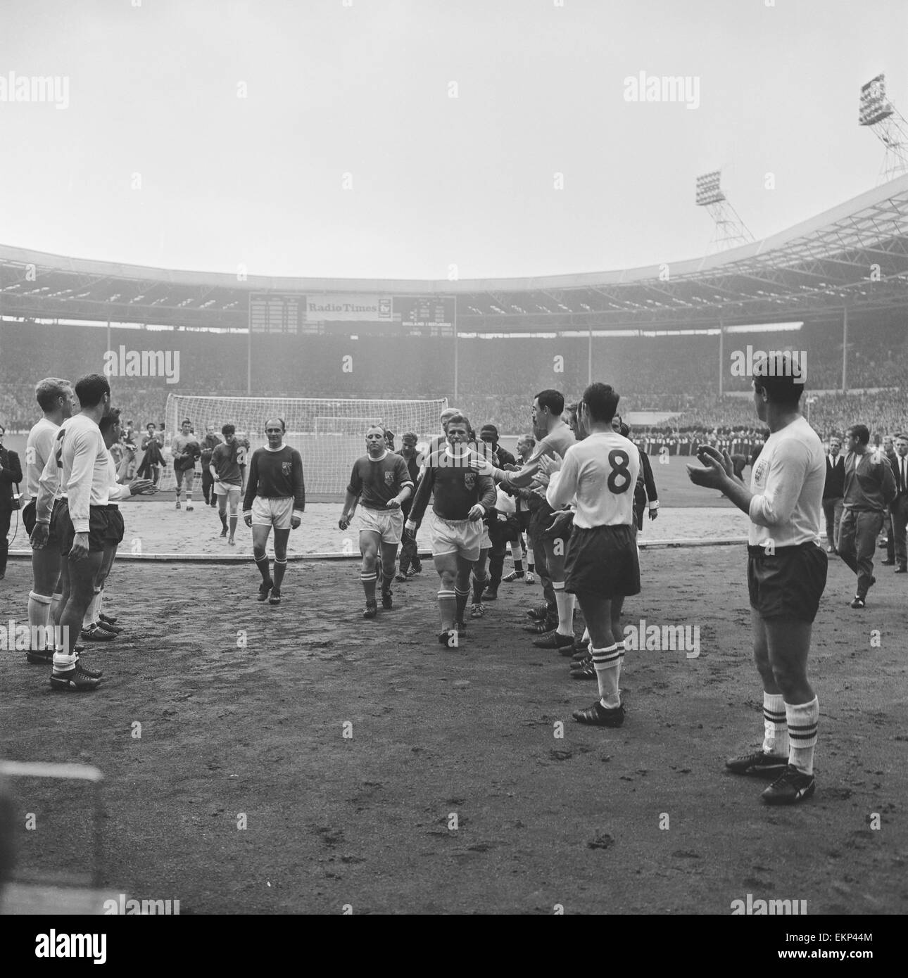 England v Rest of the World football match at Wembley stadium to celebrate 100 years of the Football Association, 23rd Octpber 1963. Ferenc Puskas leads the All Star team off the pitch tp applause from England Players including Bobby Moore, Jimmy Greaves Stock Photo