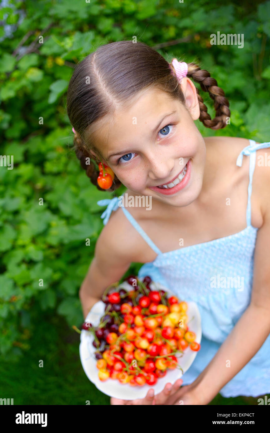 Girl eating cherries Stock Photo Alamy