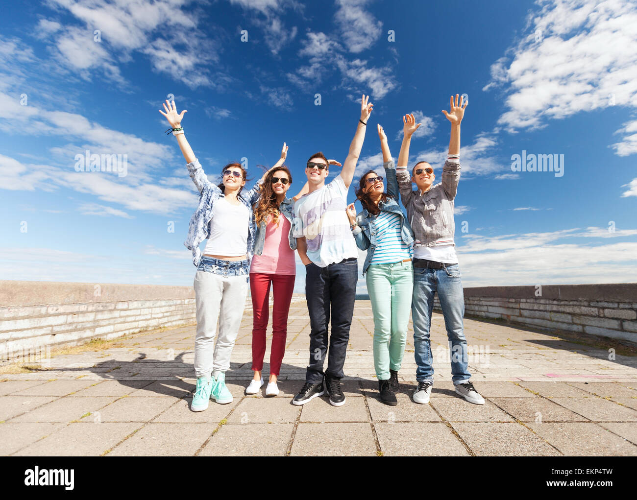group of teenagers holding hands up Stock Photo - Alamy