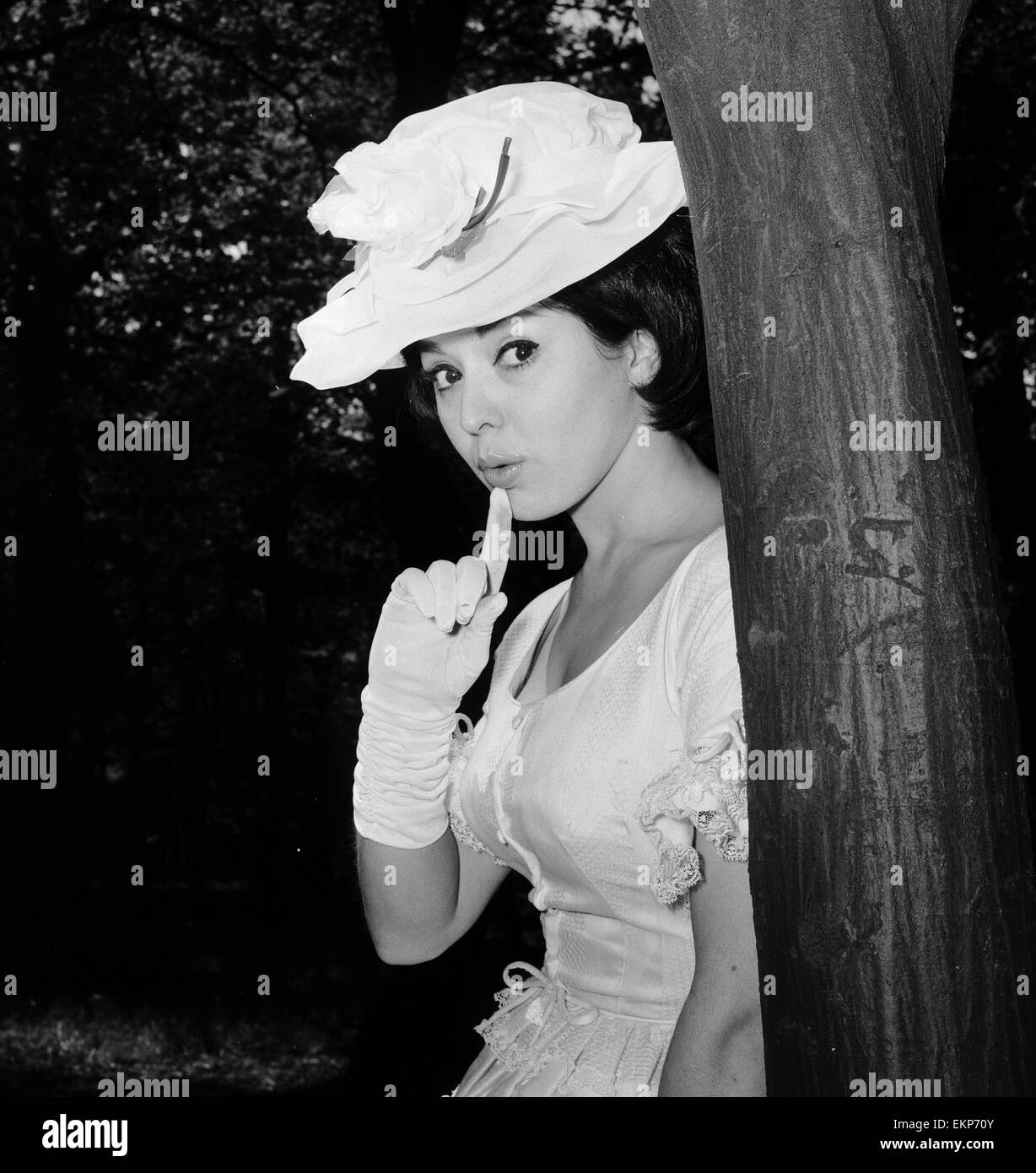Actress and singer Susan Maughan, aged 20, photographed in a park near her home in Hornsey, London wearing an Ascot styled hat and dress. 11th June 1963. Stock Photo