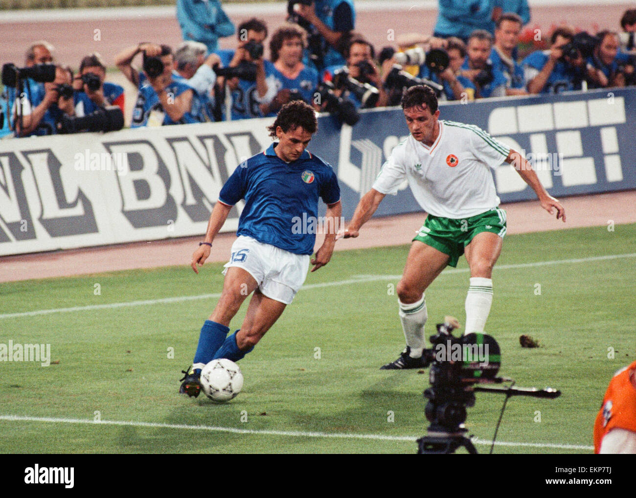 1990 World Cup Quarter Final match in Rome, Italy. Italy 1 v Republic of Ireland 0. Italy's Roberto Baggio shields the ball from Kevin Moran. 30th June 1990. Stock Photo