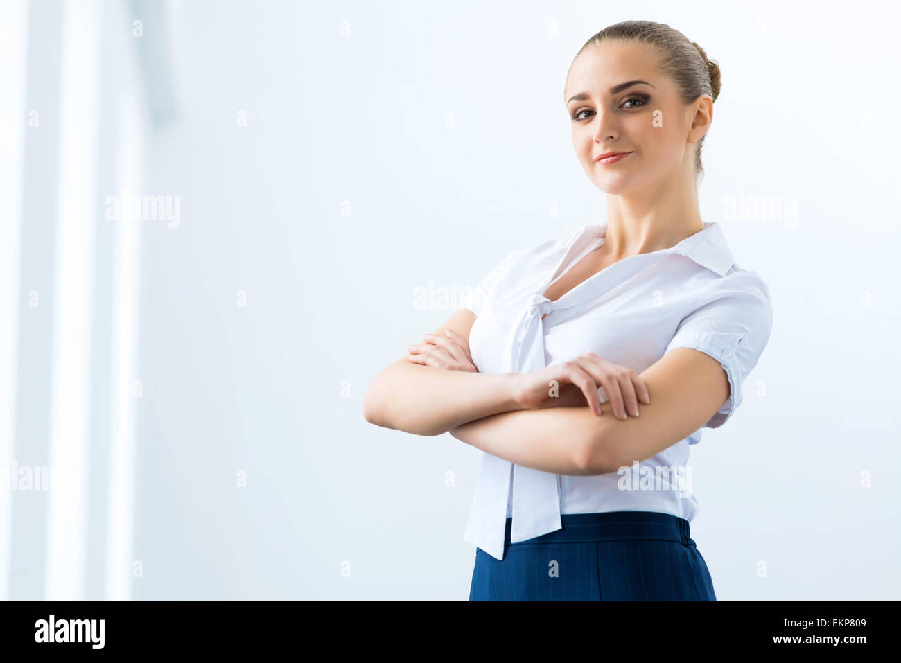 Cheerful business woman stands hi-res stock photography and images - Alamy