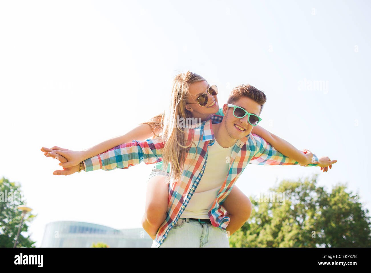 smiling couple having fun in park Stock Photo - Alamy