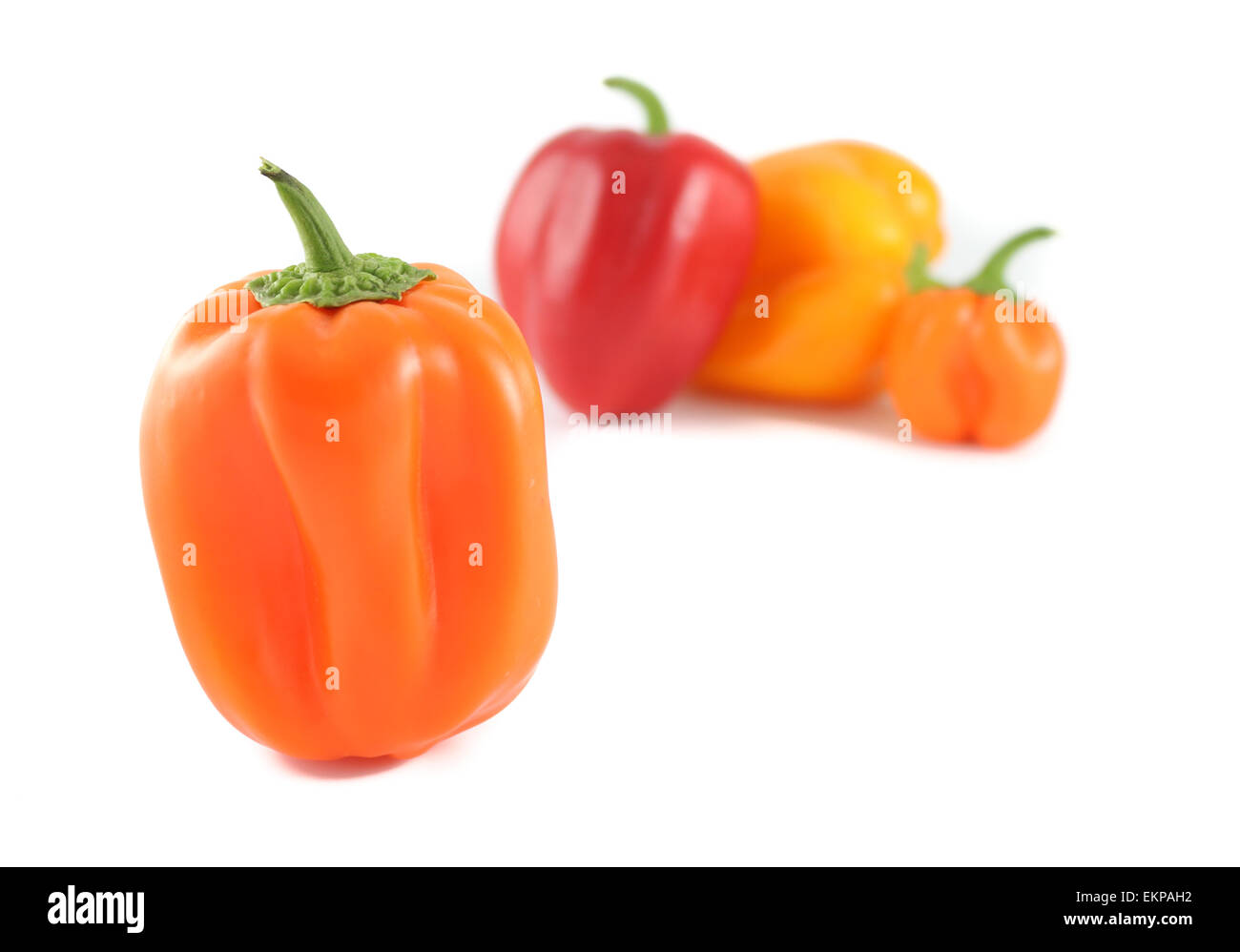 Red, Orange and Yellow Bell Peppers Stock Photo