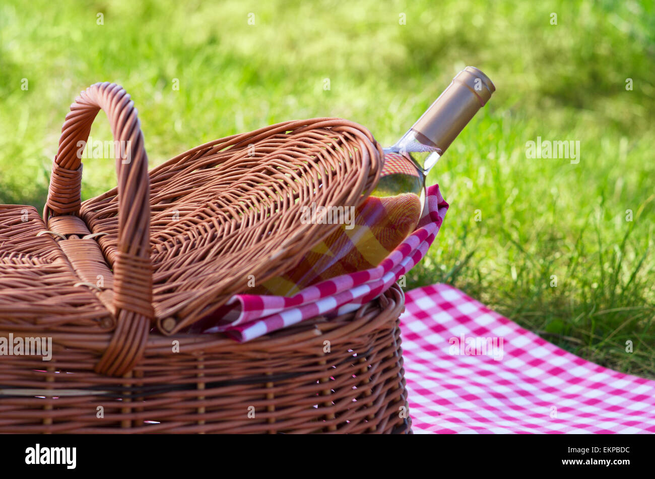 Wine bottle with picnic basket Stock Photo - Alamy
