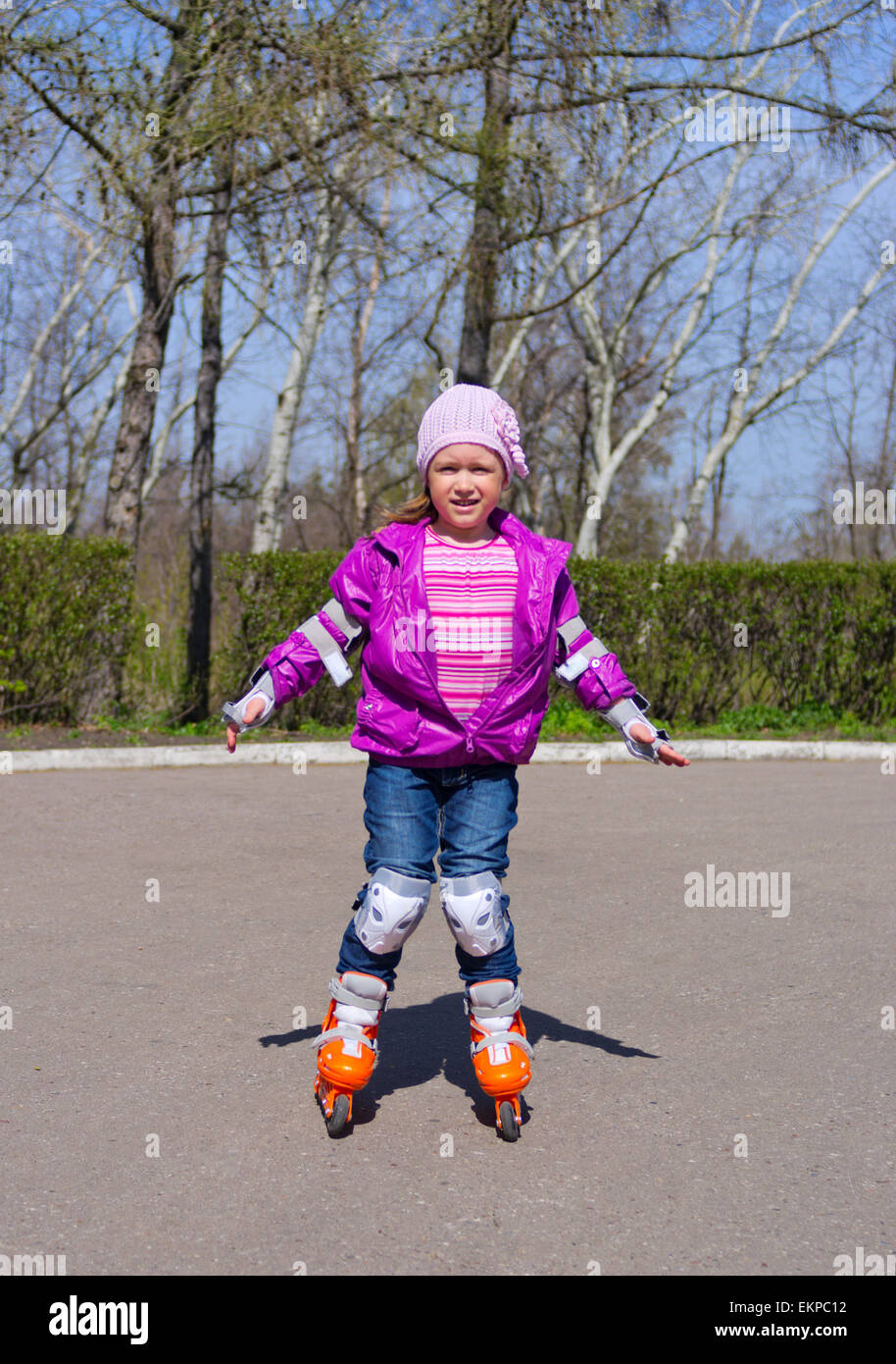 Little girl skating on roller skates Stock Photo Alamy