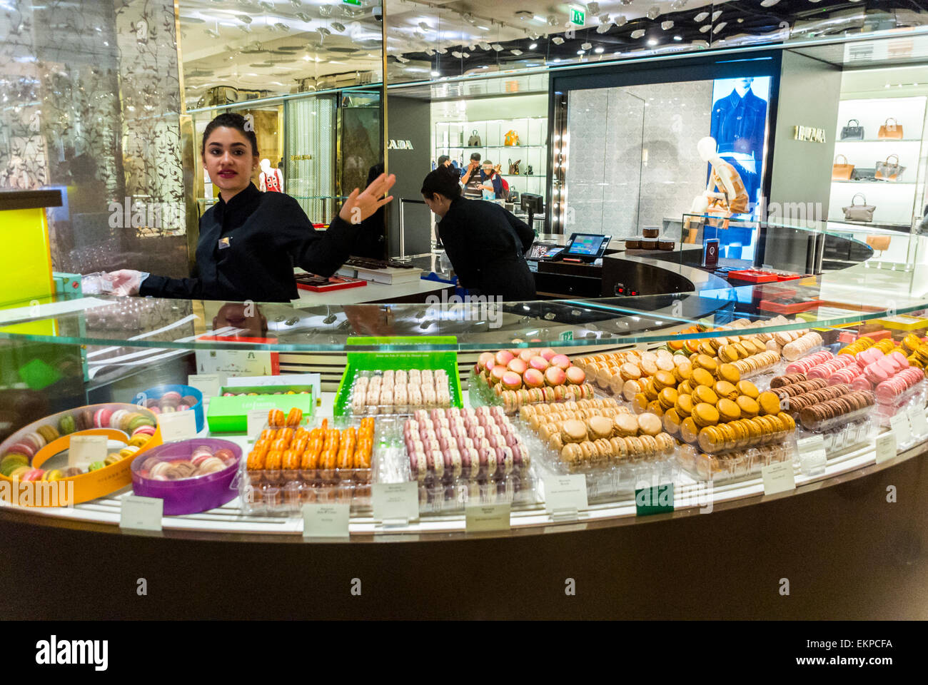 Paris, France. Woman Clerk Waving in French Chocolatier, Macaroons
