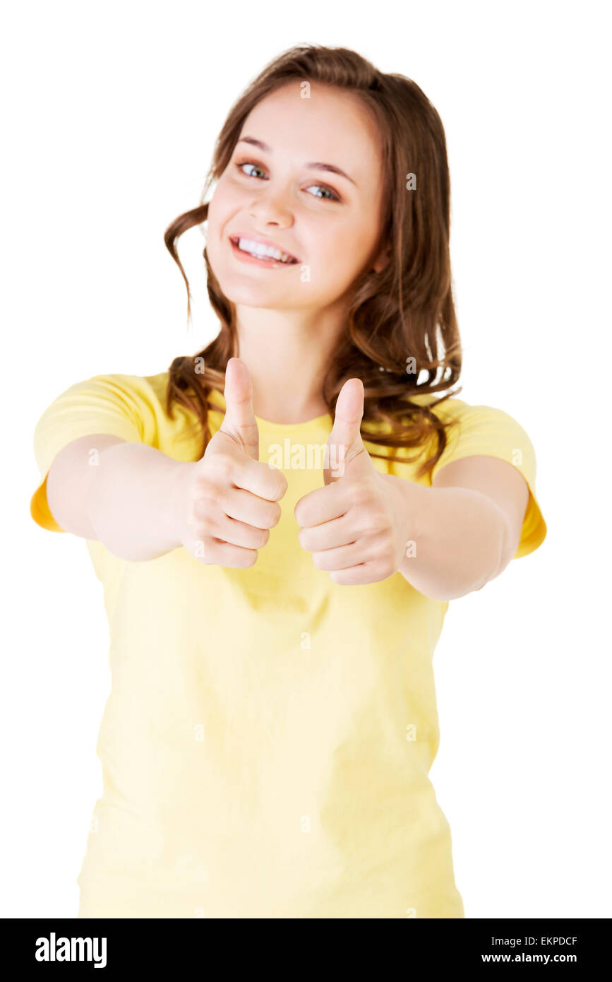 Teen woman in casual clothes gesturing thumbs up Stock Photo - Alamy